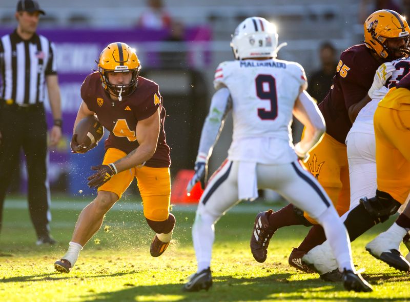 Nov 25, 2023; Tempe, Arizona, USA; Arizona State Sun Devils running back Cameron Skattebo (4) runs the ball against the Arizona Wildcats in the second half of the Territorial Cup at Mountain America Stadium. Mandatory Credit: Mark J. Rebilas-USA TODAY Sports