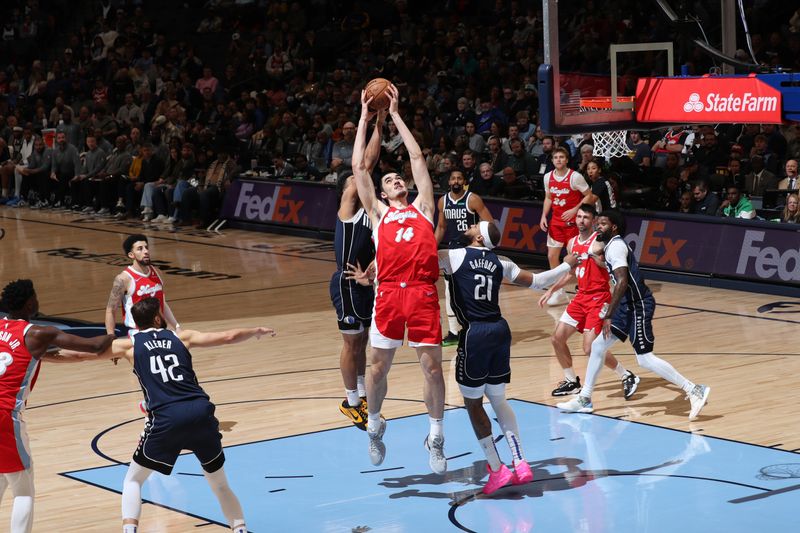 MEMPHIS, TN - JANUARY 6:   Zach Edey #14 of the Memphis Grizzlies goes up for the rebound during the game against the Dallas Mavericks on January  6, 2024 at FedExForum in Memphis, Tennessee. NOTE TO USER: User expressly acknowledges and agrees that, by downloading and or using this photograph, User is consenting to the terms and conditions of the Getty Images License Agreement. Mandatory Copyright Notice: Copyright 2024 NBAE (Photo by Joe Murphy/NBAE via Getty Images)