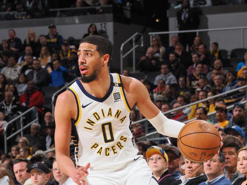 INDIANAPOLIS, IN - MARCH 18:  Tyrese Haliburton #0 of the Indiana Pacers handles the ball during the game  on March 18, 2024 at Gainbridge Fieldhouse in Indianapolis, Indiana. NOTE TO USER: User expressly acknowledges and agrees that, by downloading and or using this Photograph, user is consenting to the terms and conditions of the Getty Images License Agreement. Mandatory Copyright Notice: Copyright 2024 NBAE (Photo by Ron Hoskins/NBAE via Getty Images)