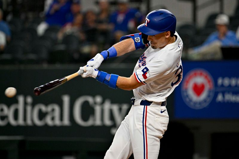 May 2, 2024; Arlington, Texas, USA; Texas Rangers center fielder Evan Carter (32) hits a singles and drives in a run against the Washington Nationals during the second inning at Globe Life Field. Mandatory Credit: Jerome Miron-USA TODAY Sports