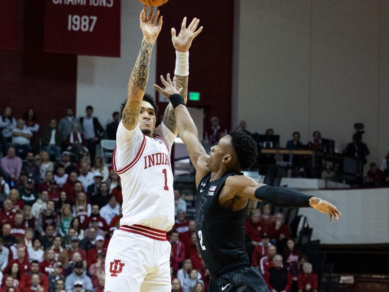 Jan 22, 2023; Bloomington, Indiana, USA; Indiana Hoosiers guard Jalen Hood-Schifino (1) shoots the ball while Michigan State Spartans guard Tyson Walker (2) defends in the first half at Simon Skjodt Assembly Hall. Mandatory Credit: Trevor Ruszkowski-USA TODAY Sports