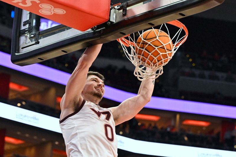 Mar 5, 2024; Louisville, Kentucky, USA; Virginia Tech Hokies guard Hunter Cattoor (0) dunks against the Louisville Cardinals during the first half at KFC Yum! Center. Mandatory Credit: Jamie Rhodes-USA TODAY Sports