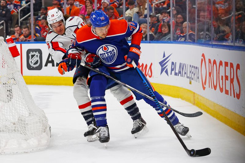 Mar 13, 2024; Edmonton, Alberta, CAN; Edmonton Oilers defensemen Vincent Desharnais (73) and Washington Capitals forward Sonny Milano (15) battle for a loose puck during the second period at Rogers Place. Mandatory Credit: Perry Nelson-USA TODAY Sports