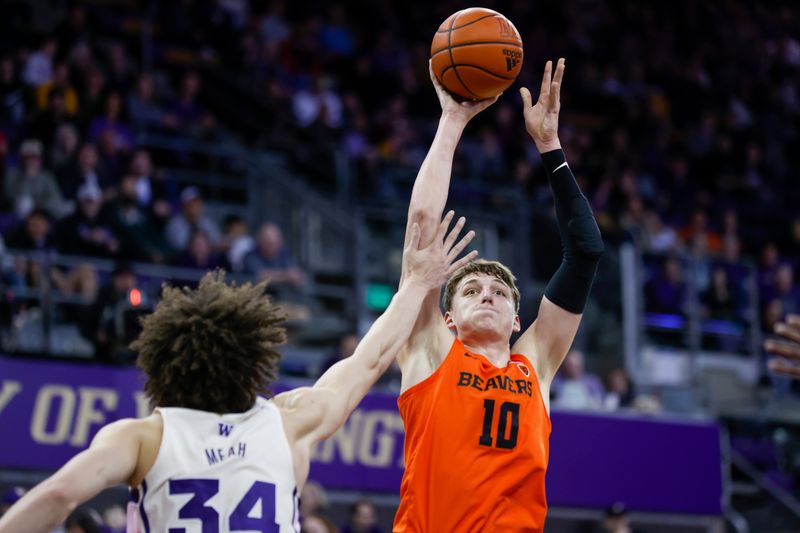 Feb 18, 2023; Seattle, Washington, USA; Oregon State Beavers forward Tyler Bilodeau (10) shoots against the Washington Huskies during the second half at Alaska Airlines Arena at Hec Edmundson Pavilion. Mandatory Credit: Joe Nicholson-USA TODAY Sports