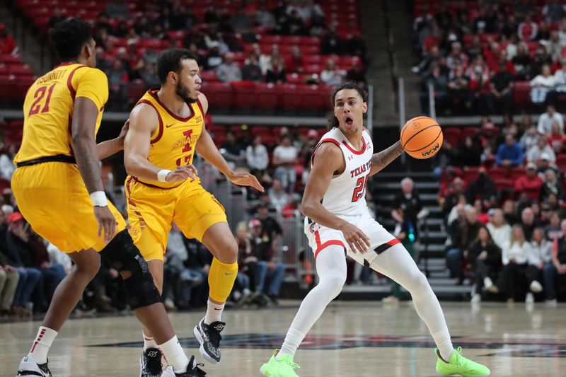 Jan 30, 2023; Lubbock, Texas, USA;  Texas Tech Red Raiders guard Jalen Tyson (20) works the ball against Iowa State Cyclones guard Jarren Holems (13) and center Osun Osunniyi (21) in the first half at United Supermarkets Arena. Mandatory Credit: Michael C. Johnson-USA TODAY Sports