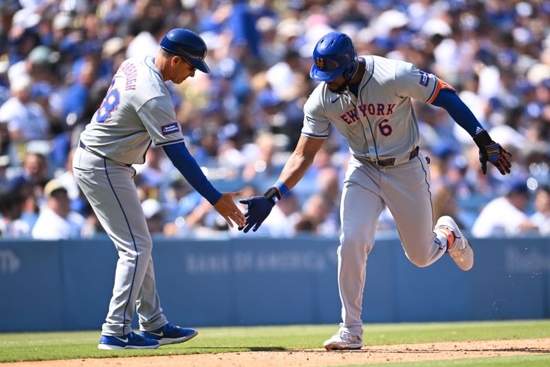 Apr 20, 2024; Los Angeles, California, USA; New York Mets outfielder Starling Marte (6) celebrates with teammates after hitting a home run against the Los Angeles Dodgers during the sixth inning at Dodger Stadium. Mandatory Credit: Jonathan Hui-USA TODAY Sports