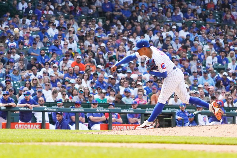 Jun 17, 2023; Chicago, Illinois, USA; Chicago Cubs relief pitcher Adbert Alzolay (73) throws the ball against the Baltimore Orioles during the ninth inning at Wrigley Field. Mandatory Credit: David Banks-USA TODAY Sports