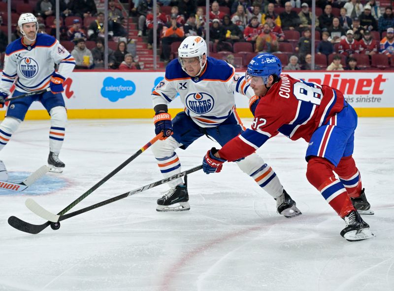 Nov 18, 2024; Montreal, Quebec, CAN; Montreal Canadiens forward Lucas Condotta (82)p/ and Edmonton Oilers defenseman Travis Dermott (24) defends during the second period at the Bell Centre. Mandatory Credit: Eric Bolte-Imagn Images