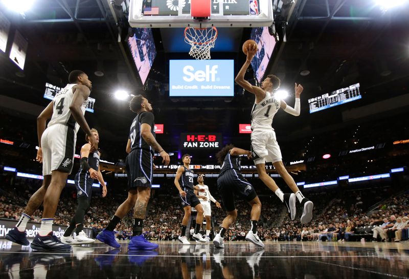 SAN ANTONIO, TX - OCTOBER 09:  Victor Wembanyama #1 of the San Antonio Spurs goes up for a shot against the Orlando Magic in the first half of a preseason game at Frost Bank Center on October 9, 2024 in San Antonio, Texas. NOTE TO USER: User expressly acknowledges and agrees that, by downloading and or using this photograph, User is consenting to terms and conditions of the Getty Images License Agreement. (Photo by Ronald Cortes/Getty Images)