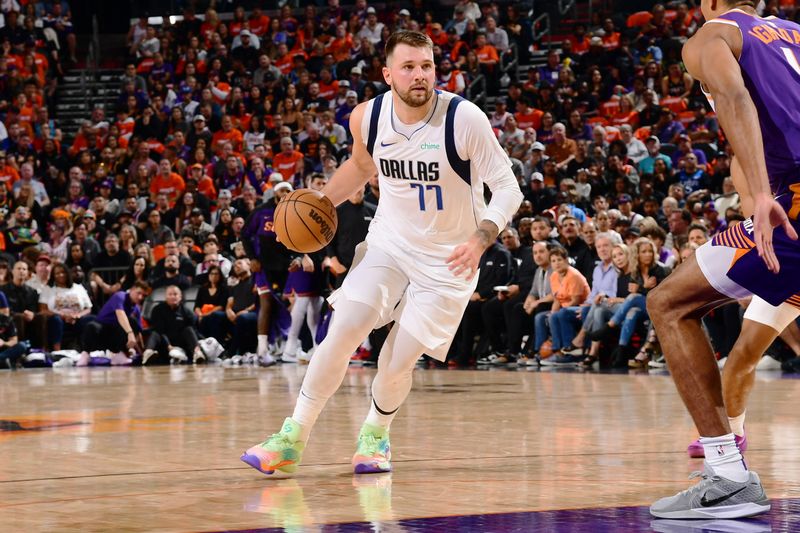 PHOENIX, AZ - OCTOBER  26: Luka Doncic #77 of the Dallas Mavericks dribbles the ball during the game against the Phoenix Suns on October 26, 2024 at Footprint Center in Phoenix, Arizona. NOTE TO USER: User expressly acknowledges and agrees that, by downloading and or using this photograph, user is consenting to the terms and conditions of the Getty Images License Agreement. Mandatory Copyright Notice: Copyright 2024 NBAE (Photo by Kate Frese/NBAE via Getty Images)