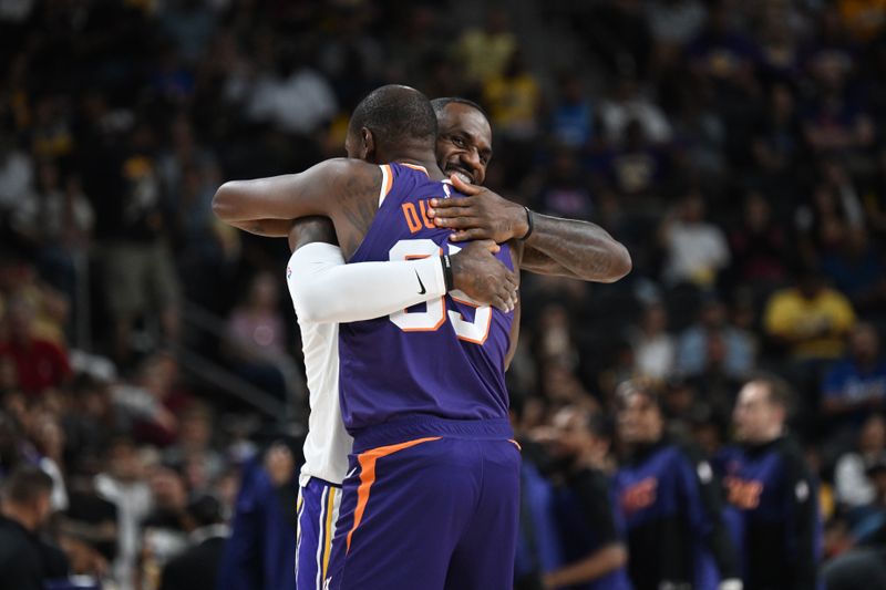 LOS ANGELES, CA - OCTOBER 6: LeBron James #23 of the Los Angeles Lakers hugs Kevin Durant #35 of the Phoenix Suns before the game on October 6, 2024 at Acrisure Arena in Palm Springs, California. NOTE TO USER: User expressly acknowledges and agrees that, by downloading and/or using this Photograph, user is consenting to the terms and conditions of the Getty Images License Agreement. Mandatory Copyright Notice: Copyright 2024 NBAE (Photo by Adam Pantozzi/NBAE via Getty Images)