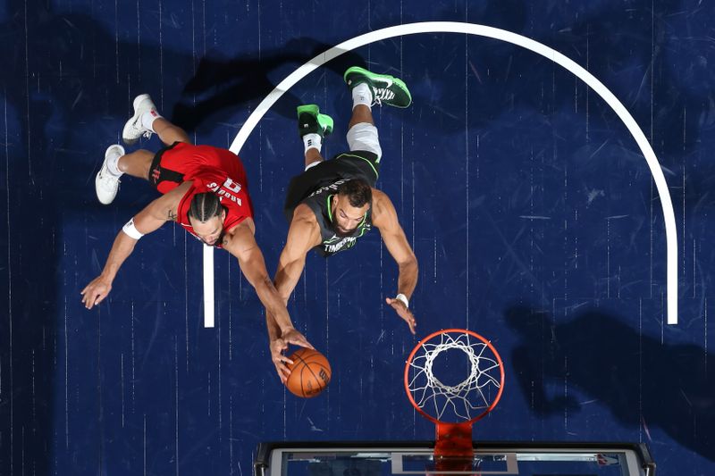 MINNEAPOLIS, MN - FEBRUARY 6: Dillon Brooks #9 of the Houston Rockets and Rudy Gobert #27 of the Minnesota Timberwolves battle for a rebound during the game on February 6, 2025 at Target Center in Minneapolis, Minnesota. NOTE TO USER: User expressly acknowledges and agrees that, by downloading and or using this Photograph, user is consenting to the terms and conditions of the Getty Images License Agreement. Mandatory Copyright Notice: Copyright 2025 NBAE(Photo by David Sherman/NBAE via Getty Images)