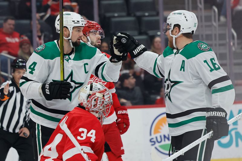 Jan 23, 2024; Detroit, Michigan, USA;  Dallas Stars defenseman Miro Heiskanen (4) receives congratulations from center Joe Pavelski (16) after scoring in the first period against the Detroit Red Wings at Little Caesars Arena. Mandatory Credit: Rick Osentoski-USA TODAY Sports