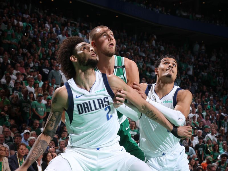 BOSTON, MA - JUNE 17: Dereck Lively II #2  and Josh Green #8 of the Dallas Mavericks box out Kristaps Porzingis #8 of the Boston Celtics during the game during Game 5 of the 2024 NBA Finals on June 17, 2024 at the TD Garden in Boston, Massachusetts. NOTE TO USER: User expressly acknowledges and agrees that, by downloading and or using this photograph, User is consenting to the terms and conditions of the Getty Images License Agreement. Mandatory Copyright Notice: Copyright 2024 NBAE  (Photo by Nathaniel S. Butler/NBAE via Getty Images)