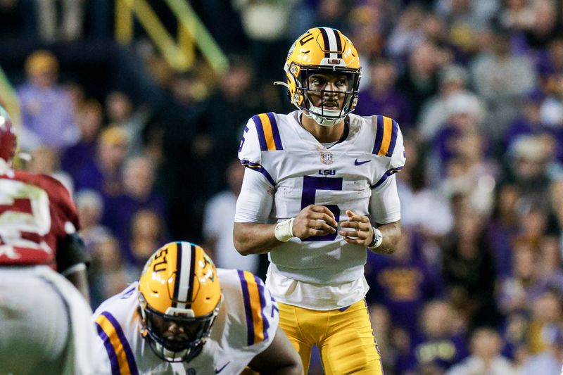 Nov 5, 2022; Baton Rouge, Louisiana, USA; LSU Tigers quarterback Jayden Daniels (5) calls for the ball against the Alabama Crimson Tide during the second half at Tiger Stadium. Mandatory Credit: Stephen Lew-USA TODAY Sports