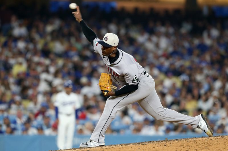 Jul 4, 2024; Los Angeles, California, USA; Arizona Diamondbacks pitcher Thyago Vieira (49) throws during the ninth inning against the Los Angeles Dodgers at Dodger Stadium. Mandatory Credit: Jason Parkhurst-USA TODAY Sports