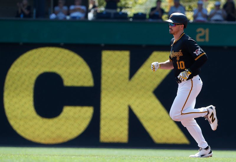 Aug 28, 2024; Pittsburgh, Pennsylvania, USA;  Pittsburgh Pirates left fielder Bryan Reynolds (10) circles the bases on a solo home run against the Chicago Cubs during the first inning at PNC Park. Mandatory Credit: Charles LeClaire-USA TODAY Sports