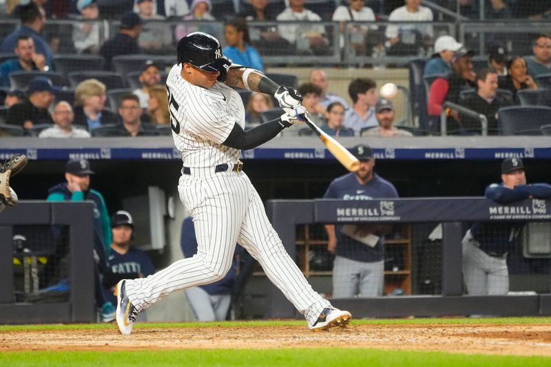 Jun 22, 2023; Bronx, New York, USA;  New York Yankees designated hitter Gleybor Torres (25) hits a single against the Seattle Mariners during the sixth inning at Yankee Stadium. Mandatory Credit: Gregory Fisher-USA TODAY Sports