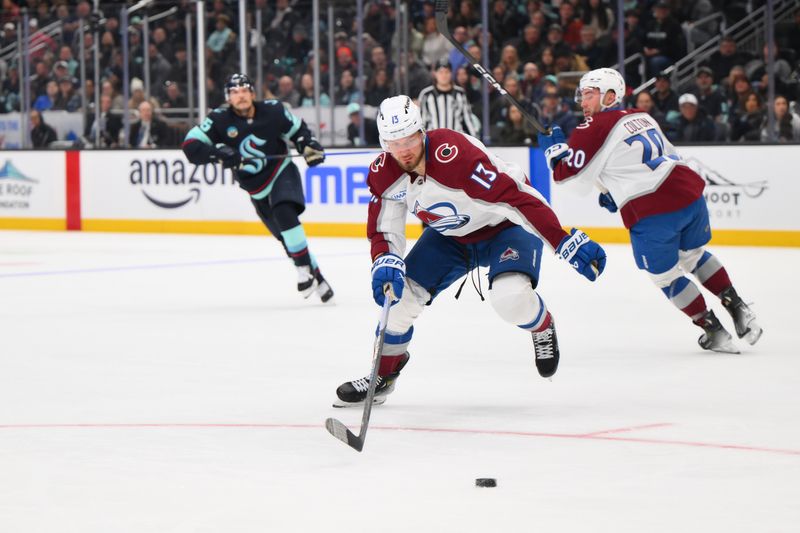 Dec 16, 2025; Seattle, Washington, USA; Colorado Avalanche right wing Valeri Nichushkin (13) plays the puck during the second period against the Seattle Kraken at Climate Pledge Arena. Mandatory Credit: Steven Bisig-Imagn Images