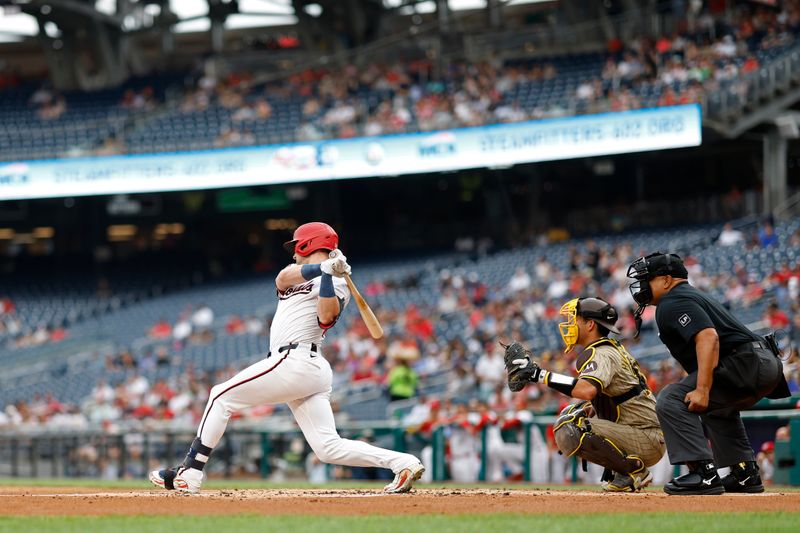 Jul 23, 2024; Washington, District of Columbia, USA; Washington Nationals outfielder Lane Thomas (28) reaches on an error by San Diego Padres third baseman Manny Machado (not pictured) during the first inning at Nationals Park. Mandatory Credit: Geoff Burke-USA TODAY Sports