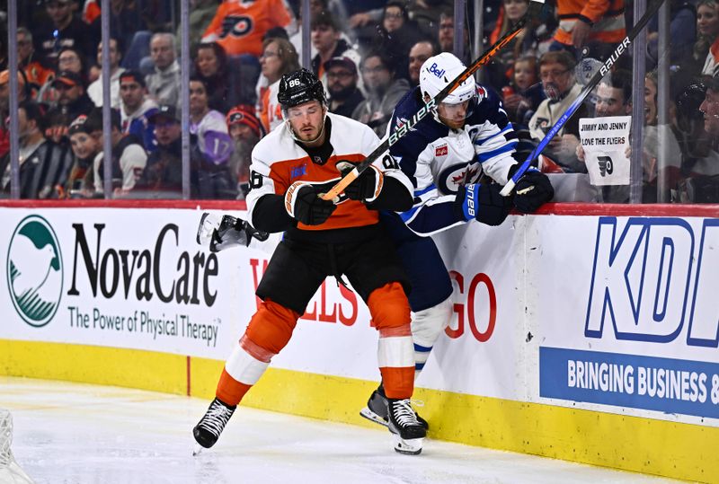 Feb 8, 2024; Philadelphia, Pennsylvania, USA; Philadelphia Flyers left wing Joel Farabee (86) hits Winnipeg Jets center Adam Lowry (17) in the third period at Wells Fargo Center. Mandatory Credit: Kyle Ross-USA TODAY Sports