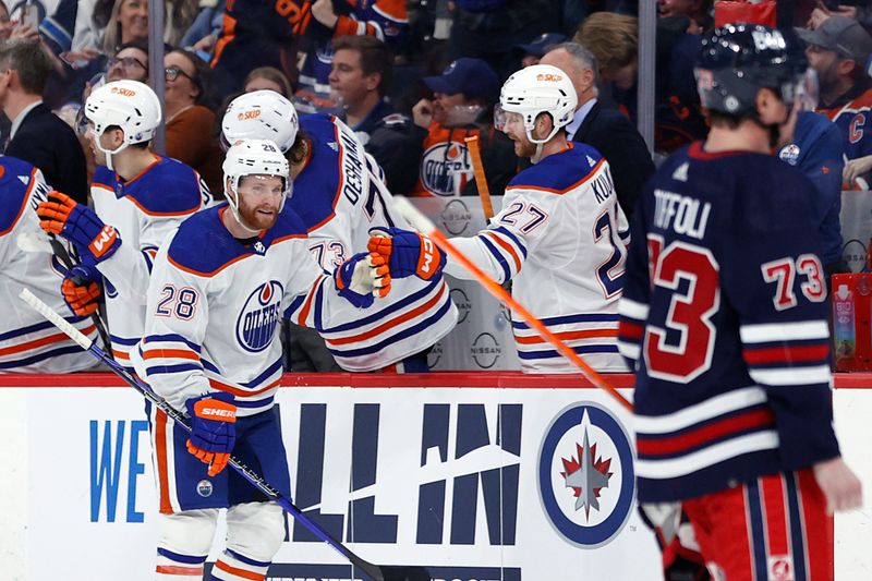 Mar 26, 2024; Winnipeg, Manitoba, CAN; Edmonton Oilers right wing Connor Brown (28) celebrates his second period goal against the Winnipeg Jets at Canada Life Centre. Mandatory Credit: James Carey Lauder-USA TODAY Sports