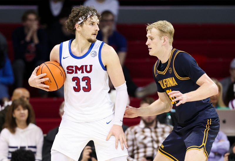 Jan 29, 2025; Dallas, Texas, USA;  Southern Methodist Mustangs forward Matt Cross (33) controls the ball as California Golden Bears forward Rytis Petraitis (31) defends during the second half at Moody Coliseum. Mandatory Credit: Kevin Jairaj-Imagn Images