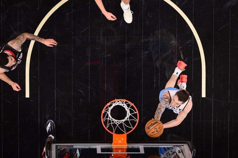 ATLANTA, GA - JANUARY 28: Vit Krejci #27 of the Atlanta Hawks drives to the basket during the game against the Houston Rockets on January 28, 2025 at State Farm Arena in Atlanta, Georgia.  NOTE TO USER: User expressly acknowledges and agrees that, by downloading and/or using this Photograph, user is consenting to the terms and conditions of the Getty Images License Agreement. Mandatory Copyright Notice: Copyright 2025 NBAE (Photo by Adam Hagy/NBAE via Getty Images)