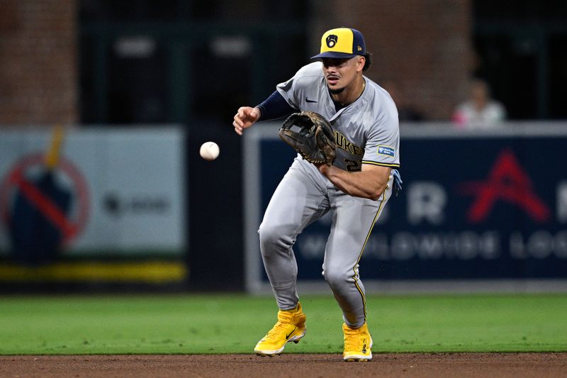 Jun 20, 2024; San Diego, California, USA; Milwaukee Brewers shortstop Willy Adames (27) fields a ground ball hit by San Diego Padres shortstop Ha-Seong Kim (not pictured) during the sixth inning at Petco Park. Mandatory Credit: Orlando Ramirez-USA TODAY Sports