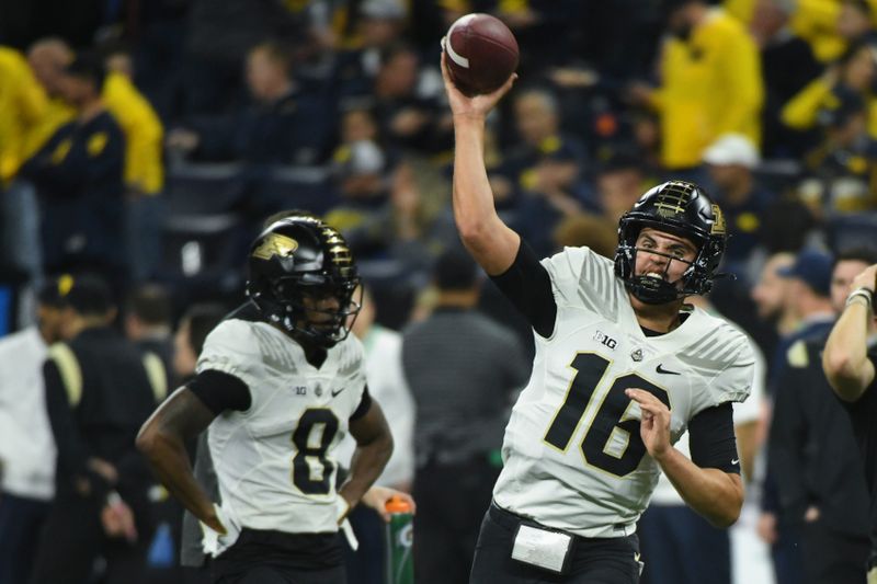 Dec 3, 2022; Indianapolis, Indiana, USA;  Purdue Boilermakers quarterback Aidan O'Connell (16) passes during warmups before the Big Ten Championship against the Michigan Wolverines at Lucas Oil Stadium. Mandatory Credit: Robert Goddin-USA TODAY Sports