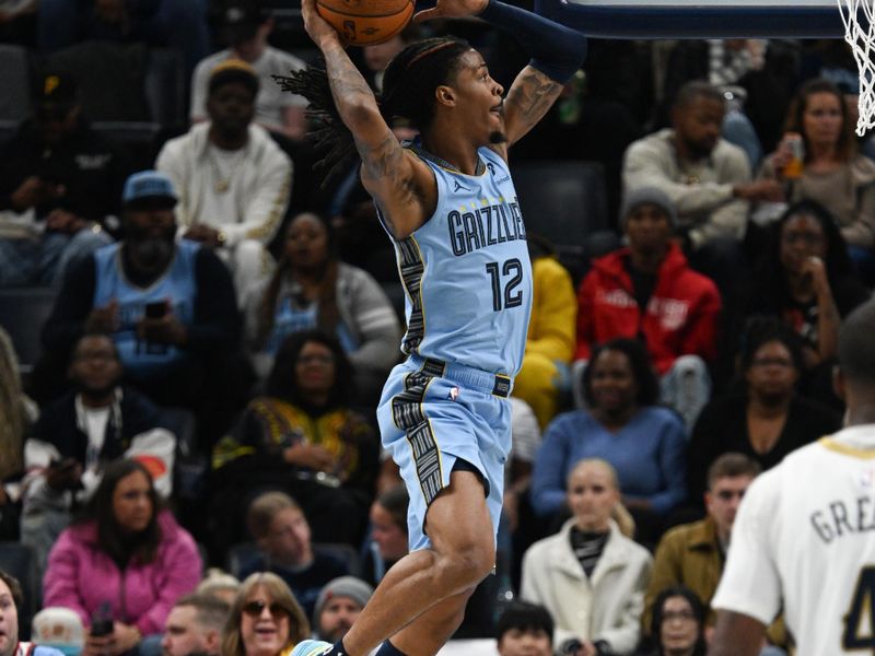 MEMPHIS, TN - NOVEMBER 29: Ja Morant #12 of the Memphis Grizzlies dunks the ball during the game against the New Orleans Pelicans during the Emirates NBA Cup game on November 29, 2024 at FedExForum in Memphis, Tennessee. NOTE TO USER: User expressly acknowledges and agrees that, by downloading and or using this photograph, User is consenting to the terms and conditions of the Getty Images License Agreement. Mandatory Copyright Notice: Copyright 2024 NBAE (Photo by Grant Burke/NBAE via Getty Images)