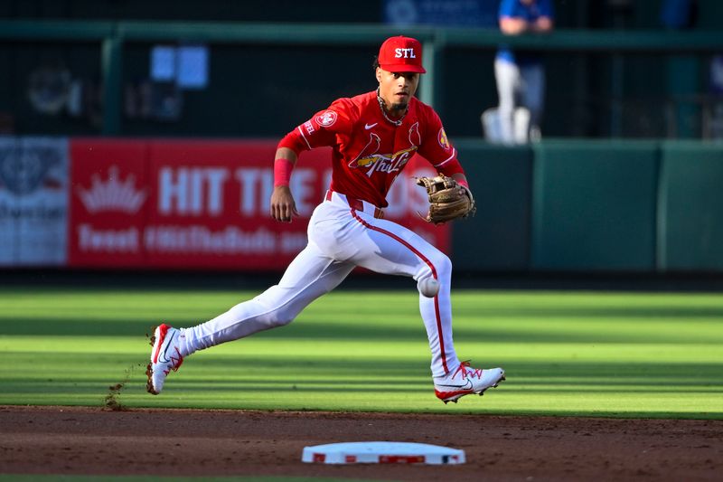 May 25, 2024; St. Louis, Missouri, USA;  St. Louis Cardinals shortstop Masyn Winn (0) fields a ground ball against the Chicago Cubs during the second inning at Busch Stadium. Mandatory Credit: Jeff Curry-USA TODAY Sports