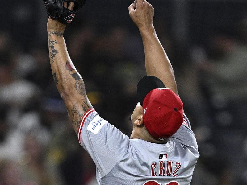 Apr 29, 2024; San Diego, California, USA; Cincinnati Reds relief pitcher Fernando Cruz (63) celebrates after pitching the eighth inning against the San Diego Padres at Petco Park. Mandatory Credit: Orlando Ramirez-USA TODAY Sports