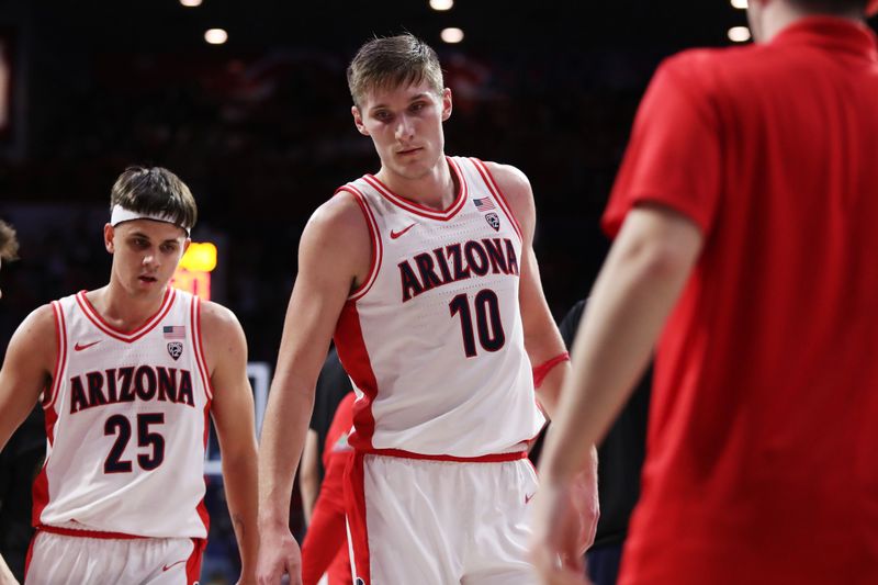 Feb 2, 2023; Tucson, Arizona, USA;Arizona Wildcats forward Azuolas Tubelis (10) walks to the bench with Arizona Wildcats guard Kerr Kriisa (25) in the second half at McKale Center. Mandatory Credit: Zachary BonDurant-USA TODAY Sports