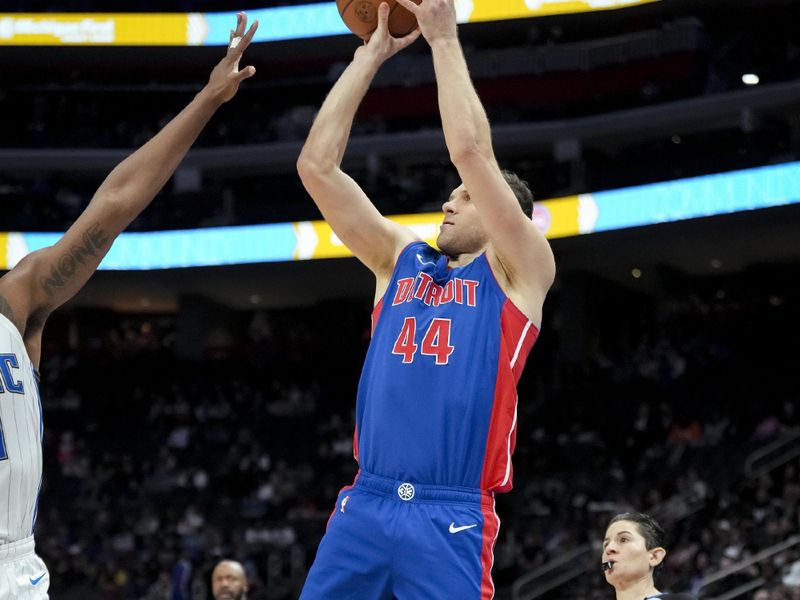 DETROIT, MICHIGAN - FEBRUARY 04: Bojan Bogdanovic #44 of the Detroit Pistons shoots the ball against Wendell Carter Jr. #34 of the Orlando Magic during the fourth quarter at Little Caesars Arena on February 04, 2024 in Detroit, Michigan. NOTE TO USER: User expressly acknowledges and agrees that, by downloading and or using this photograph, User is consenting to the terms and conditions of the Getty Images License Agreement. (Photo by Nic Antaya/Getty Images)