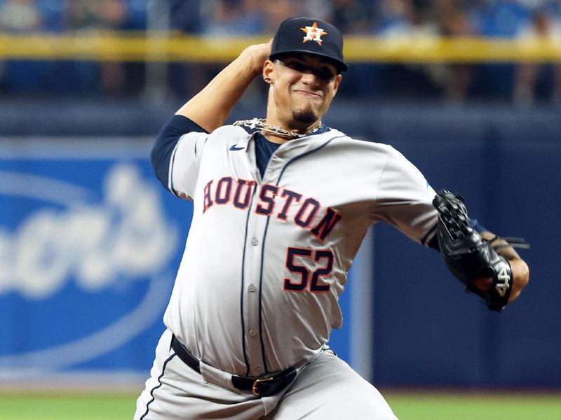 Aug 14, 2024; St. Petersburg, Florida, USA; Houston Astros pitcher Bryan Abreu (52) throws a pitch against the Tampa Bay Rays during the eight inning at Tropicana Field. Mandatory Credit: Kim Klement Neitzel-USA TODAY Sports