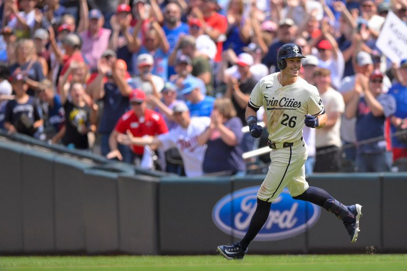 Jul 24, 2024; Minneapolis, Minnesota, USA;  Minnesota Twins outfielder Max Kepler (26) celebrates his game-winning RBI single against the Philadelphia Phillies during the ninth inning at Target Field. Mandatory Credit: Nick Wosika-USA TODAY Sports