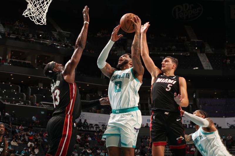 CHARLOTTE, NC - OCTOBER 8: Miles Bridges #0 of the Charlotte Hornets drives to the basket during the game against the Miami Heat during a preseason game on October 8, 2024 at Spectrum Center in Charlotte, North Carolina. NOTE TO USER: User expressly acknowledges and agrees that, by downloading and or using this photograph, User is consenting to the terms and conditions of the Getty Images License Agreement. Mandatory Copyright Notice: Copyright 2024 NBAE (Photo by Kent Smith/NBAE via Getty Images)