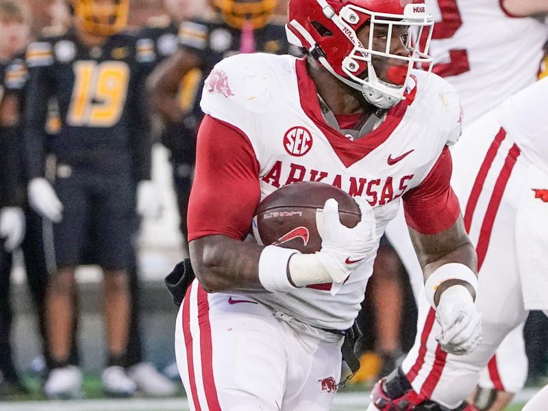 Nov 25, 2022; Columbia, Missouri, USA; Arkansas Razorbacks running back Raheim Sanders (5) runs the ball against the Missouri Tigers during the first half at Faurot Field at Memorial Stadium. Mandatory Credit: Denny Medley-USA TODAY Sports