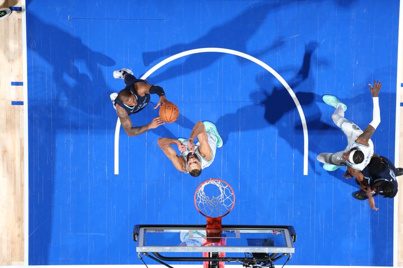 MINNEAPOLIS, MN -  JANUARY 18: Xavier Tillman #2 of the Memphis Grizzlies shoots the ball during the game against the Minnesota Timberwolves on January 18, 2024 at Target Center in Minneapolis, Minnesota. NOTE TO USER: User expressly acknowledges and agrees that, by downloading and or using this Photograph, user is consenting to the terms and conditions of the Getty Images License Agreement. Mandatory Copyright Notice: Copyright 2024 NBAE (Photo by David Sherman/NBAE via Getty Images)