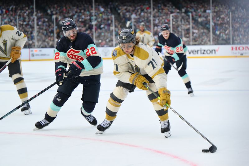 Jan 1, 2024; Seattle, Washington, USA; Vegas Golden Knights center William Karlsson (71) plays the puck while defended by Seattle Kraken right wing Oliver Bjorkstrand (22) during the 3rd period in the 2024 Winter Classic ice hockey game at T-Mobile Park. Mandatory Credit: Steven Bisig-USA TODAY Sports