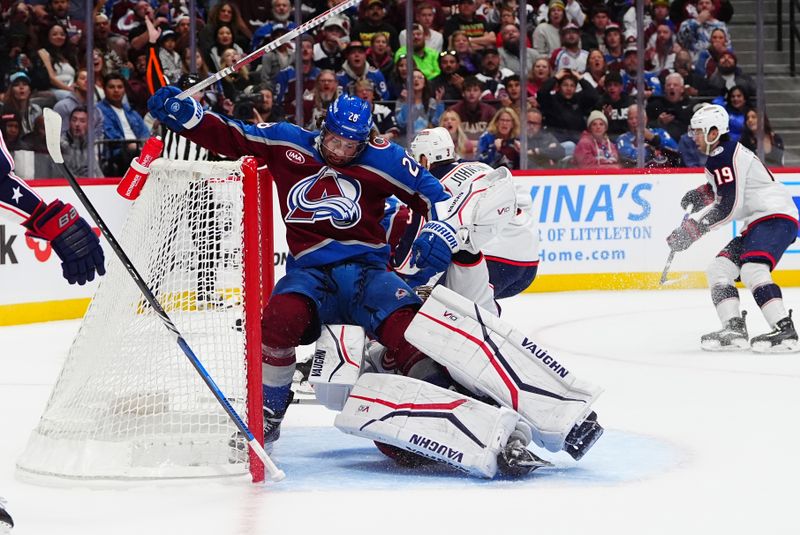 Oct 12, 2024; Denver, Colorado, USA; Colorado Avalanche left wing Miles Wood (28) crashes into Columbus Blue Jackets goaltender Daniil Tarasov (40) in the second period at Ball Arena. Mandatory Credit: Ron Chenoy-Imagn Images