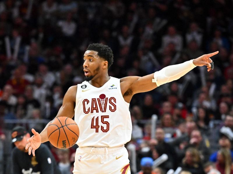 CLEVELAND, OHIO - MARCH 31: Donovan Mitchell #45 of the Cleveland Cavaliers brings the ball up court during the third quarter against the New York Knicks at Rocket Mortgage Fieldhouse on March 31, 2023 in Cleveland, Ohio. The Knicks defeated the Cavaliers 130-116. NOTE TO USER: User expressly acknowledges and agrees that, by downloading and or using this photograph, User is consenting to the terms and conditions of the Getty Images License Agreement. (Photo by Jason Miller/Getty Images)