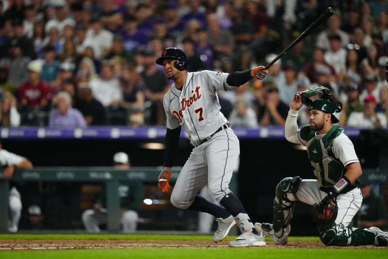 Jul 1, 2023; Denver, Colorado, USA; Detroit Tigers second baseman Jonathan Schoop (7) hits an RBI double in the seventh inning against the Colorado Rockies at Coors Field. Mandatory Credit: Ron Chenoy-USA TODAY Sports