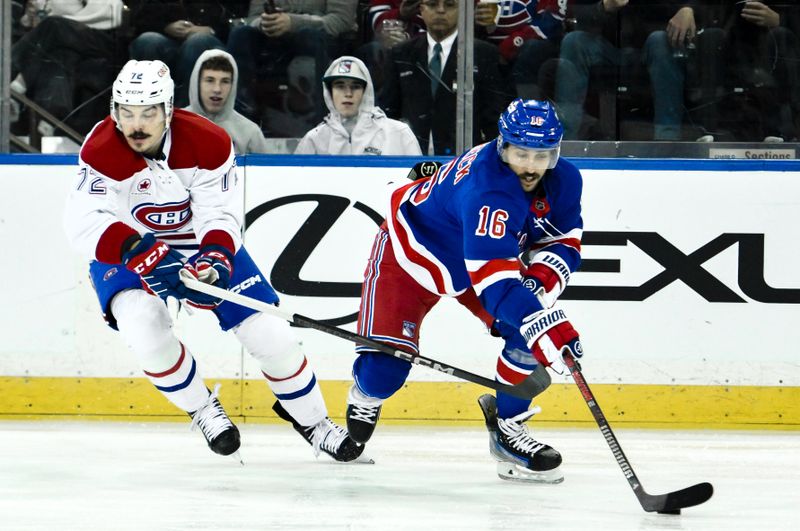 Nov 30, 2024; New York, New York, USA; New York Rangers center Vincent Trocheck (16) skates with the puck against Montreal Canadiens defenseman Arber Xhekaj (72) during the second period at Madison Square Garden. Mandatory Credit: John Jones-Imagn Images