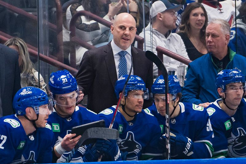 Jan 18, 2024; Vancouver, British Columbia, CAN; Vancouver Canucks head coach Rick Tocchet on the bench against the Arizona Coyotes in the second period at Rogers Arena. Mandatory Credit: Bob Frid-USA TODAY Sports