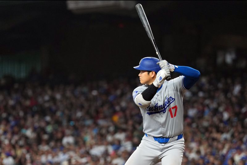 Sep 2, 2024; Phoenix, Arizona, USA; Los Angeles Dodgers two-way player Shohei Ohtani (17) bats against the Arizona Diamondbacks during the eighth inning at Chase Field. Mandatory Credit: Joe Camporeale-USA TODAY Sports