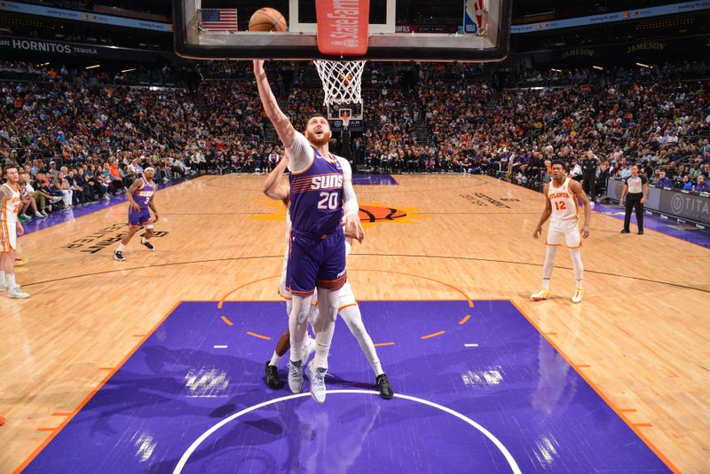 PHOENIX, AZ - MARCH 21: Jusuf Nurkic #20 of the Phoenix Suns goes to the basket during the game on March 21, 2024 at Footprint Center in Phoenix, Arizona. NOTE TO USER: User expressly acknowledges and agrees that, by downloading and or using this photograph, user is consenting to the terms and conditions of the Getty Images License Agreement. Mandatory Copyright Notice: Copyright 2024 NBAE (Photo by Barry Gossage/NBAE via Getty Images)