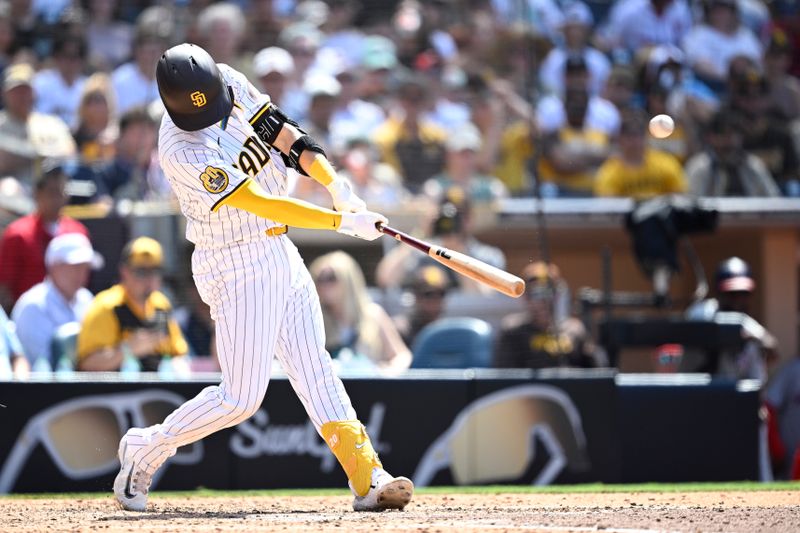 Jun 26, 2024; San Diego, California, USA; San Diego Padres catcher Kyle Higashioka (20) hits a grand slam home run against the Washington Nationals during the eighth inning at Petco Park. Mandatory Credit: Orlando Ramirez-USA TODAY Sports