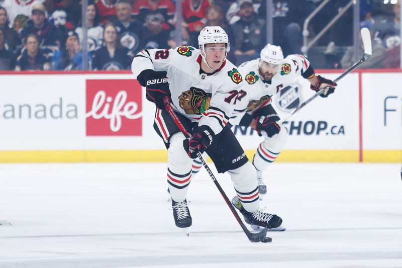 Oct 11, 2024; Winnipeg, Manitoba, CAN;  Chicago Blackhawks defenseman Alex Vlasic (72) skates into the Winnipeg Jets zone during the first period at Canada Life Centre. Mandatory Credit: Terrence Lee-Imagn Images